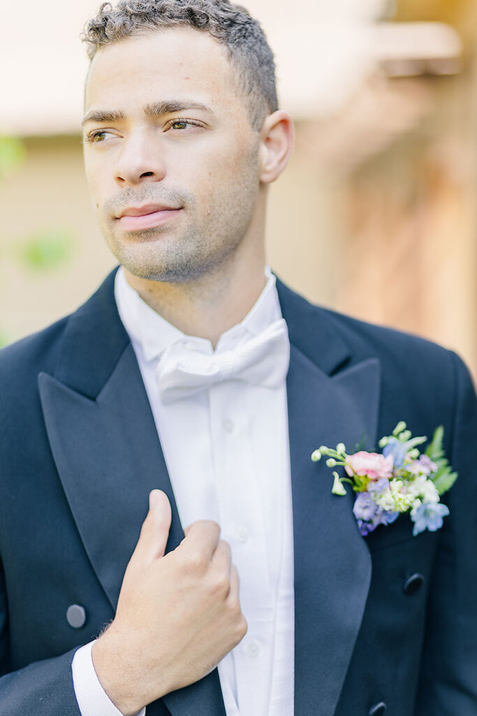 spring groom with pastel boutonniere