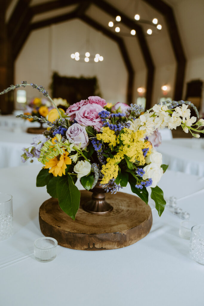 summer wedding flowers purple and yellow sunflower centerpiece