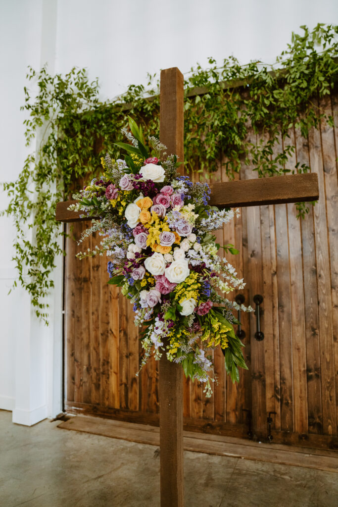 Kansas City wedding florist summer wedding flowers purple and yellow floral cross spray