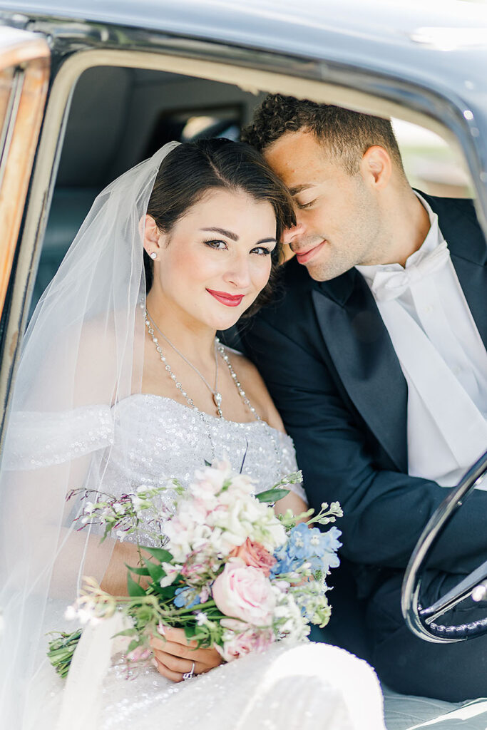 spring bride holding pastel bridal bouquet