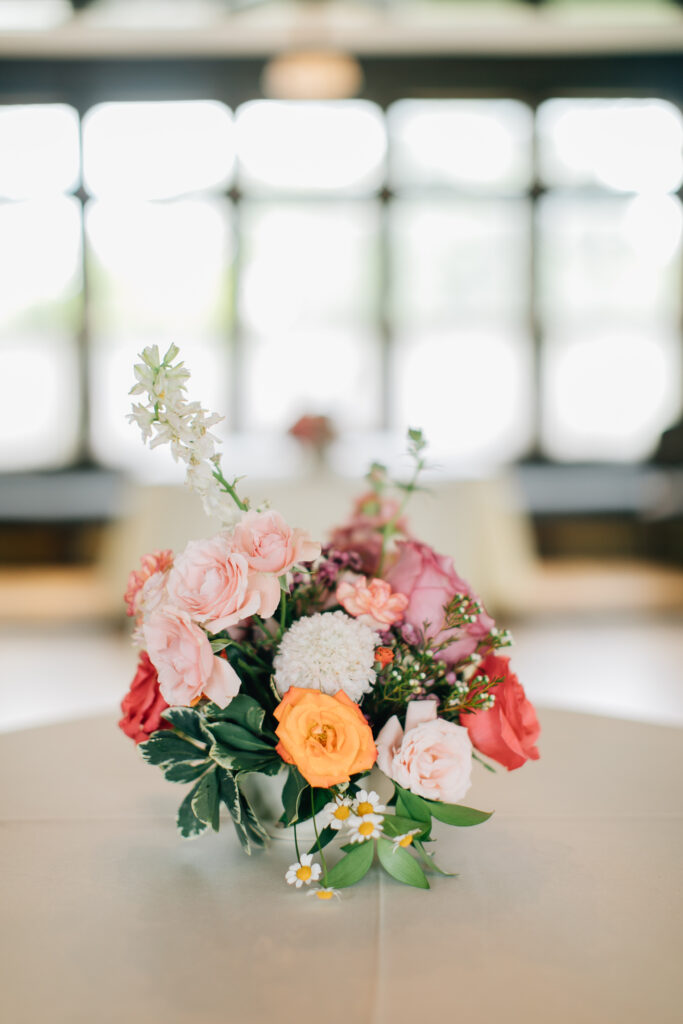 summer wedding flowers cocktail  citrus and pink floral centerpiece